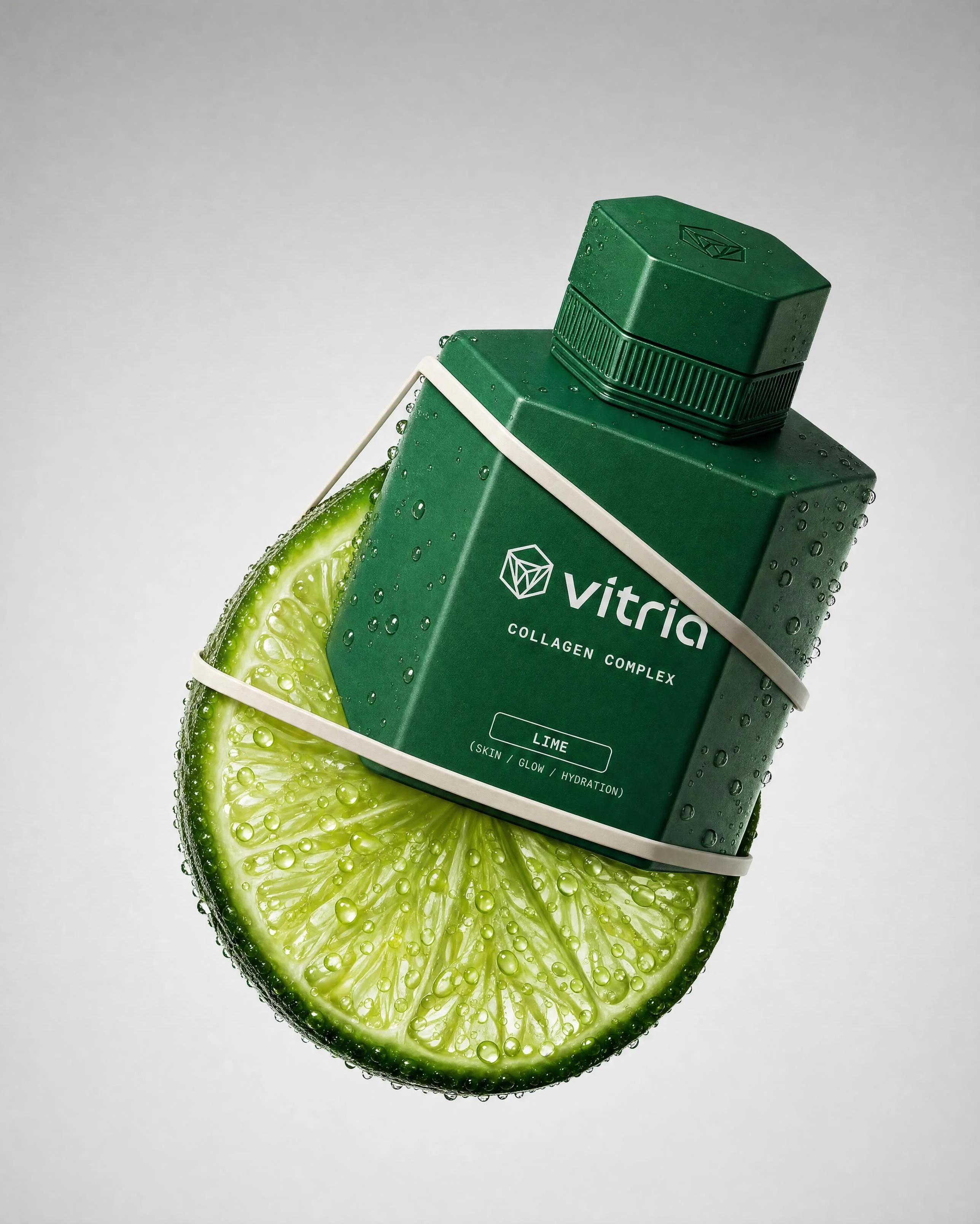 VITRIA: The First Cut — Hero shot — the Lime bottle wrapped in a citrus slice