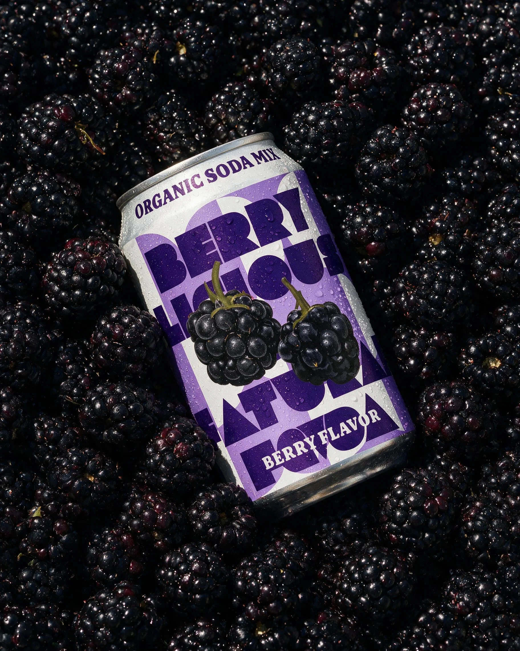 Mixed berry photoshoot: can surrounded by mixed berries