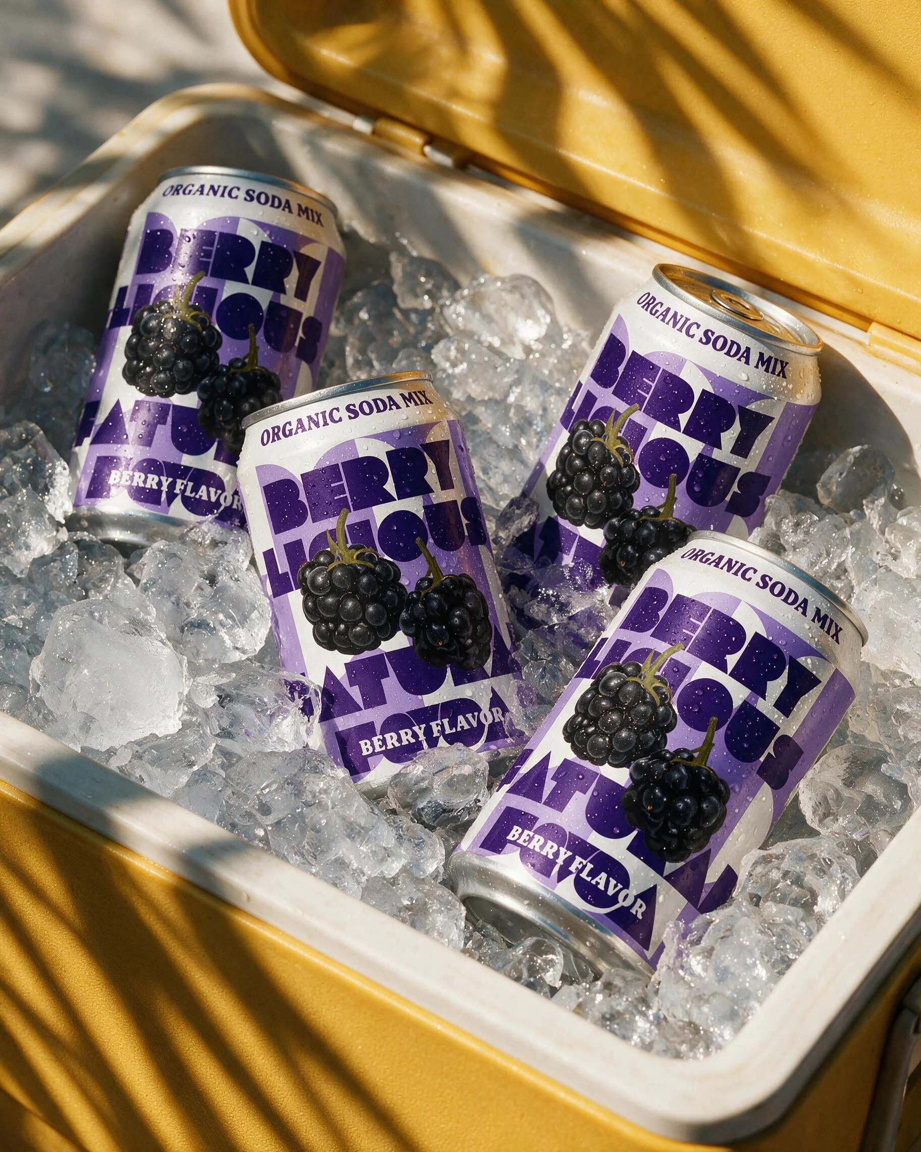 Mixed berry photoshoot: cans in an ice-filled cooler