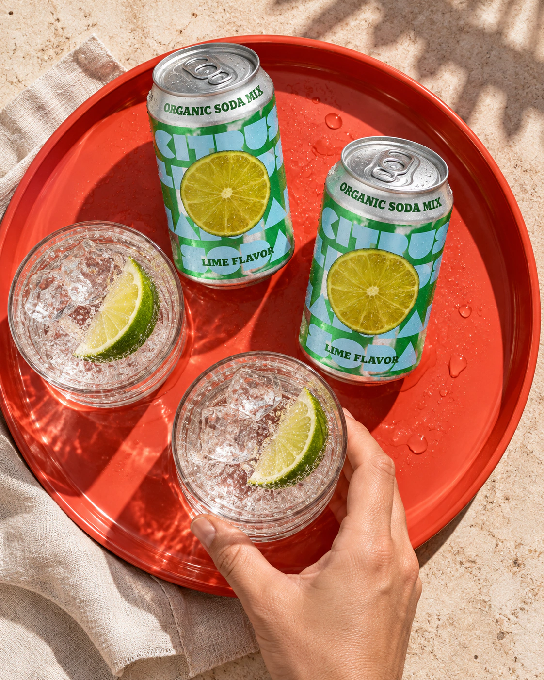 Lime flavour reference: cans and a glass on a red tray